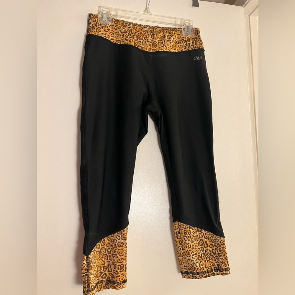 N.Y.L leggings with the animal print on the sides and the top, size M